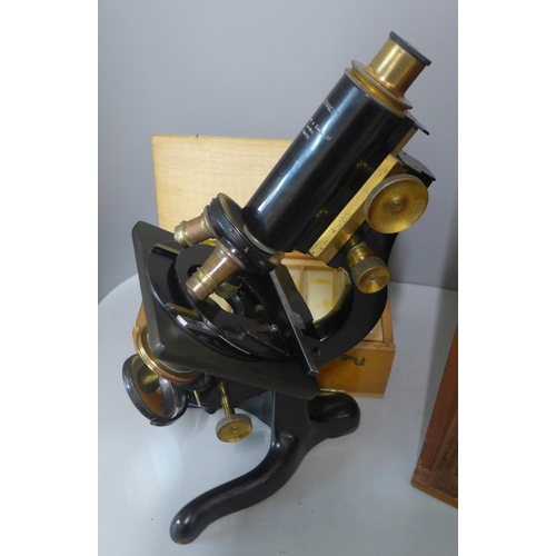 280 - A vintage cased microscope with slides, W. Watson & Sons Ltd., London