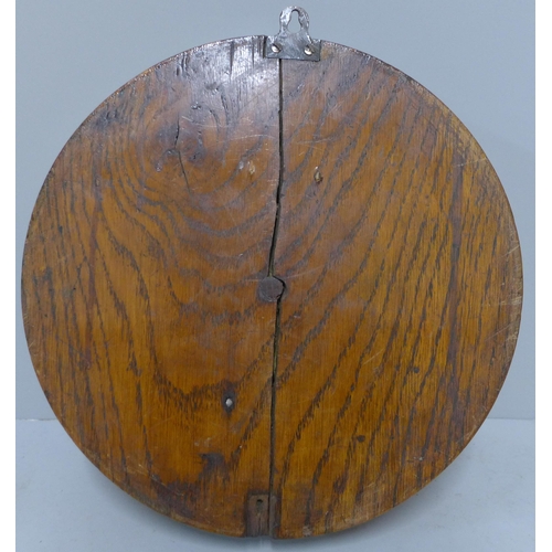 283 - An early 20th Century Dent carved oak circular wall clock