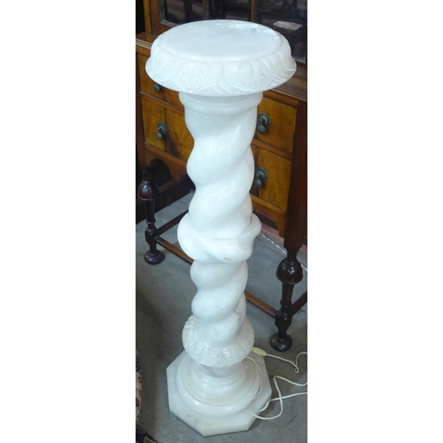 292 - A French onyx barleytwist jardiniere stand