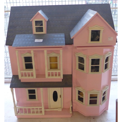 298 - A painted doll's house with accessories