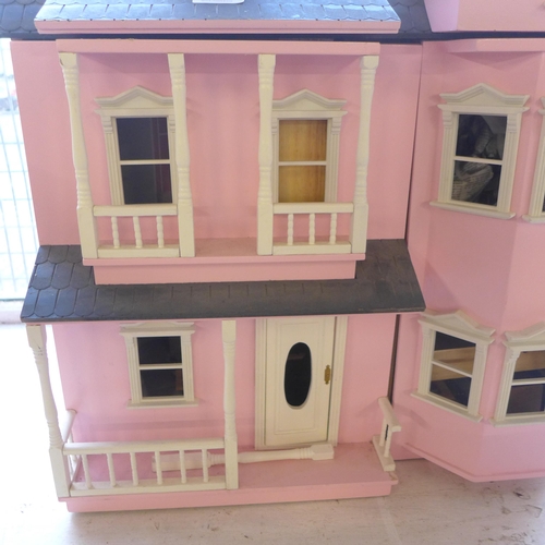 298 - A painted doll's house with accessories