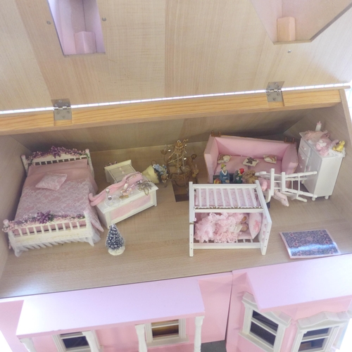 298 - A painted doll's house with accessories