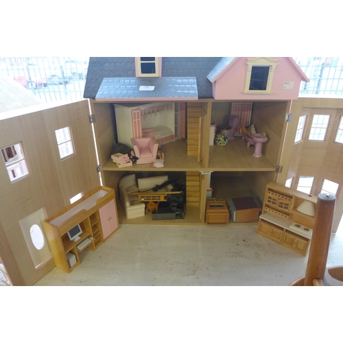 298 - A painted doll's house with accessories