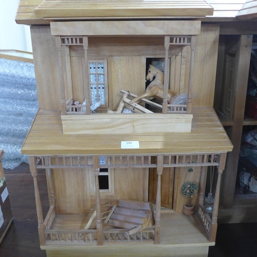 299 - A large wooden doll's house with accessories