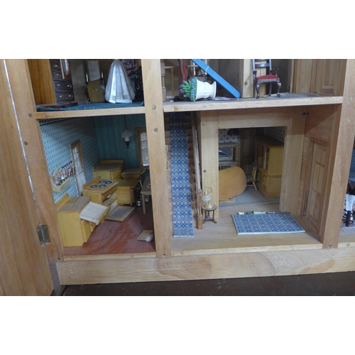 299 - A large wooden doll's house with accessories