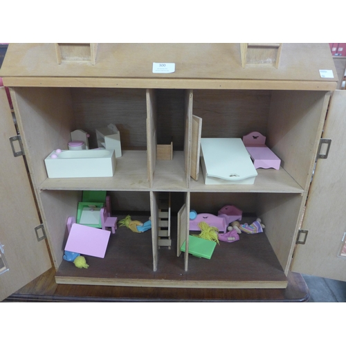 300 - A wooden doll's house, with accessories