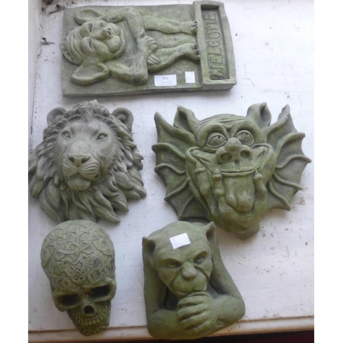 301 - Two concrete gargoyles, welcome sign, lion and a skull