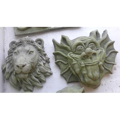 301 - Two concrete gargoyles, welcome sign, lion and a skull