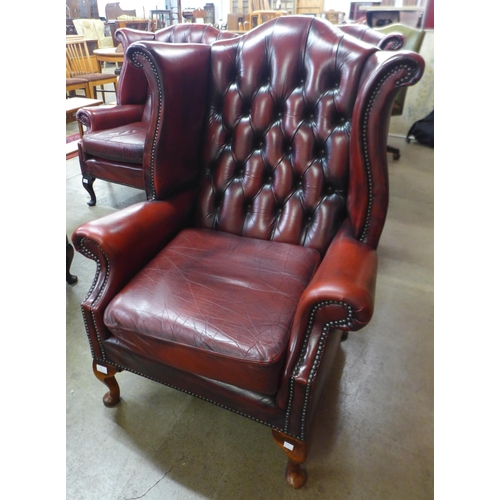 42 - A Chesterfield red leather wingback armchair