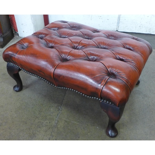 44 - A Chesterfield red leather footstool