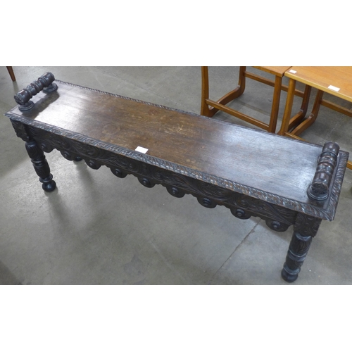 49 - A Victorian Jacobean Revival carved oak window seat