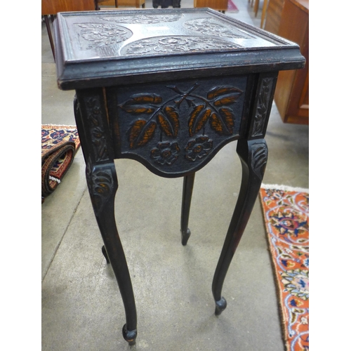 51 - A Victorian carved oak jardiniere stand