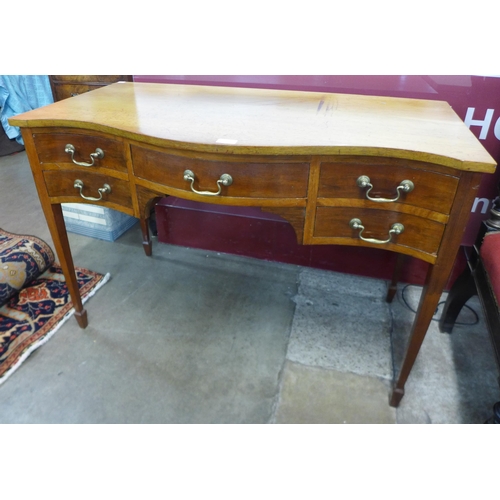 52 - An Edward VII mahogany five drawer serpentine writing table