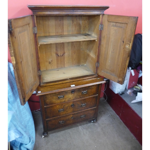 54 - A 19th Century French walnut two door cupboard on chest