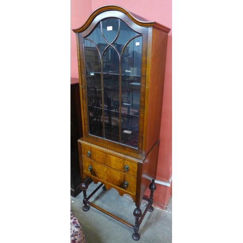 55 - An early to mid 20th Century walnut display cabinet