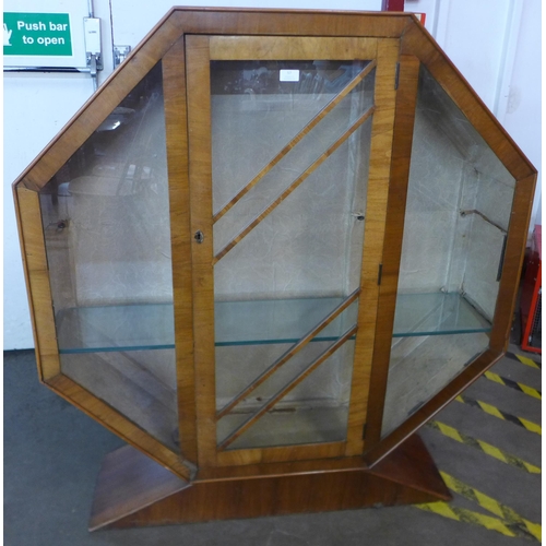 57 - An Art Deco walnut octagonal display cabinet