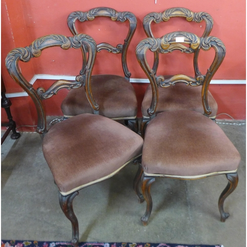 64 - A set of four Victorian walnut dining chairs