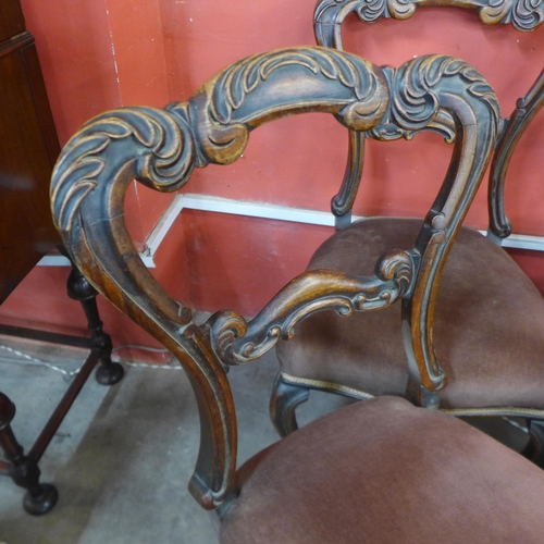 64 - A set of four Victorian walnut dining chairs