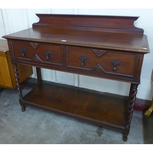 68 - An early 20th Century oak two drawer barleytwist serving table