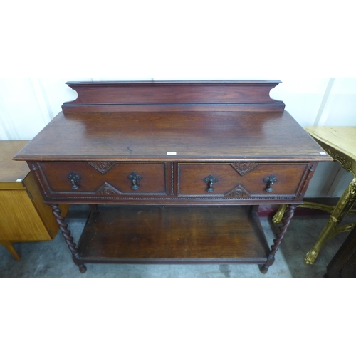 68 - An early 20th Century oak two drawer barleytwist serving table