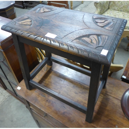 76 - A carved oak stool