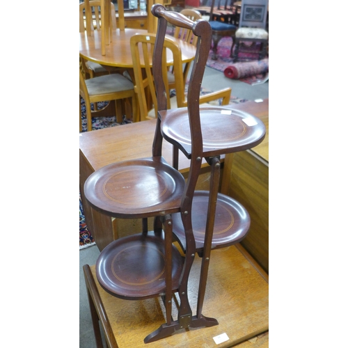 77 - An Edward VII inlaid mahogany three tier folding cake stand