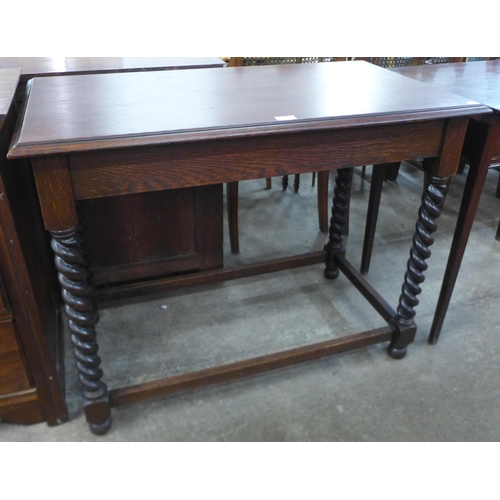 79 - An oak barleytwist hall table