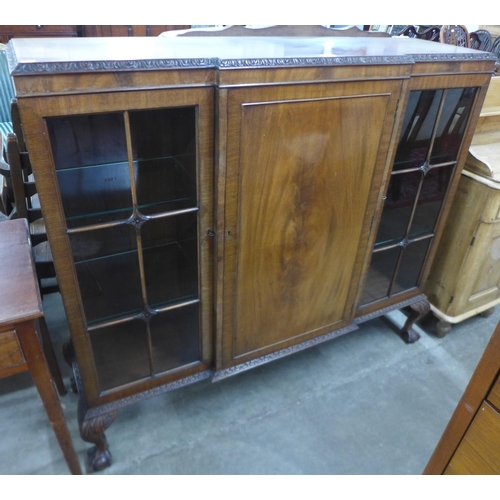 82 - An Edward VII mahogany three door carved mahogany bookcase