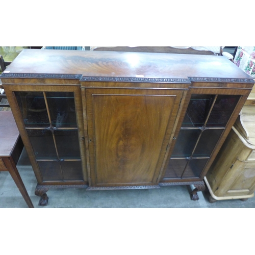 82 - An Edward VII mahogany three door carved mahogany bookcase