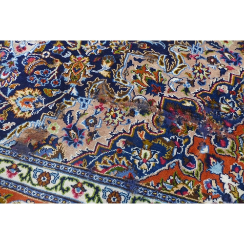 85 - An eastern blue ground rug, 314 x 225cms