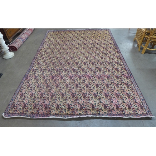 87 - An eastern beige ground rug, 323 x 223cms