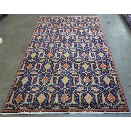 88 - An eastern blue ground rug, 273 x 169cms