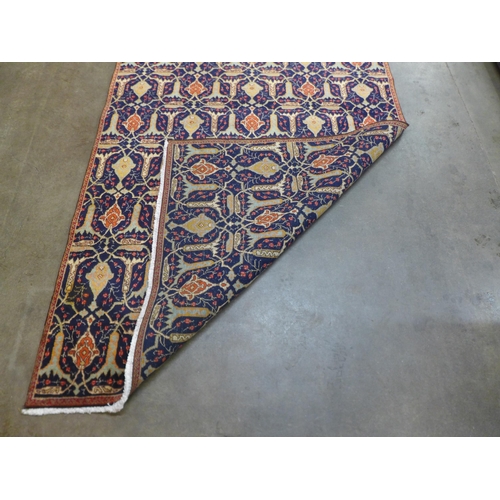 88 - An eastern blue ground rug, 273 x 169cms