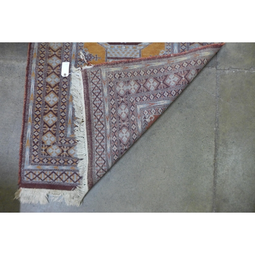 89 - An eastern brown ground rug, 158 x 93cms