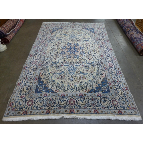 93 - An eastern cream ground rug, 300 x 190cms