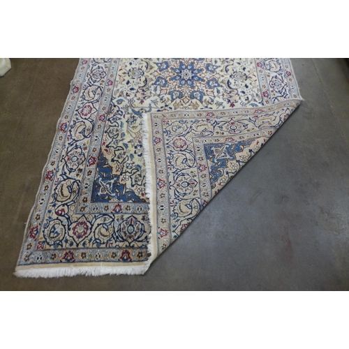 93 - An eastern cream ground rug, 300 x 190cms