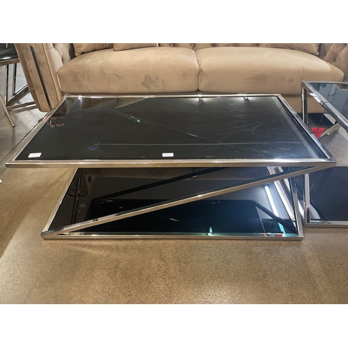 1305 - A black glass and chrome coffee table and lamp table * this lot is subject to VAT