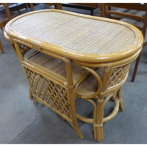 171 - A bamboo and wicker table and two chairs