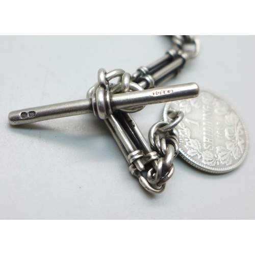 1010 - A silver fancy link Albert watch chain, T-bar marked Birmingham 1896, with 1895 South Africa shillin... 