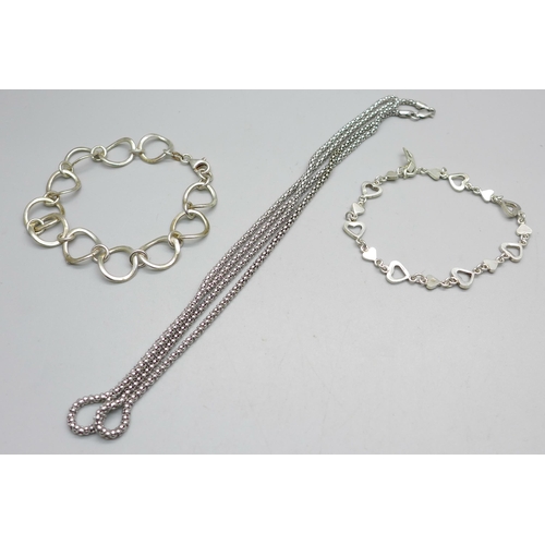 1024 - Two silver bracelets and a silver neck chain, 25g, chain 74cm