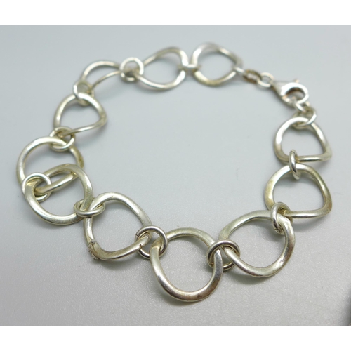 1024 - Two silver bracelets and a silver neck chain, 25g, chain 74cm