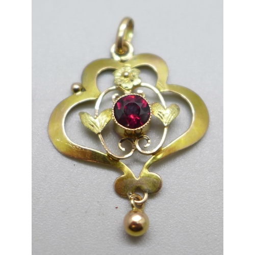 1036 - A 9ct gold and garnet pendant, 1.2g