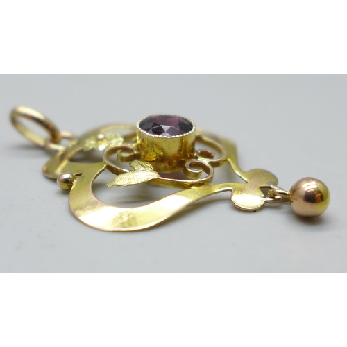 1036 - A 9ct gold and garnet pendant, 1.2g