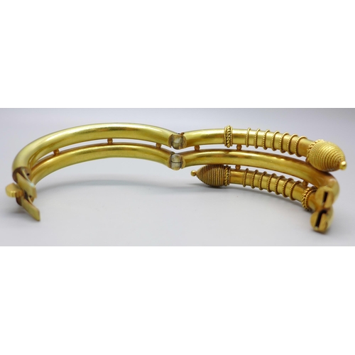 1049 - A Victorian snake style gilt metal bangle with hinge opening, inner dimensions 45mm x 58mm, 61g