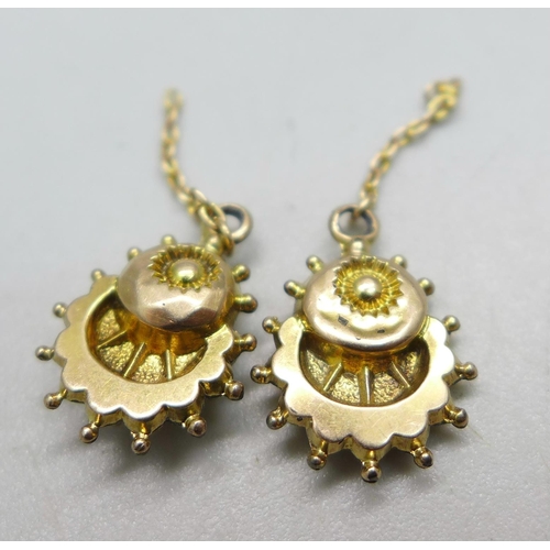 1052 - A pair of Edwardian yellow metal pendant earrings, test as 9ct gold, require hooks, 1.3g