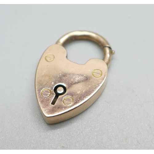 1054 - A 9ct gold padlock clasp with unusual mechanism, 2.9g