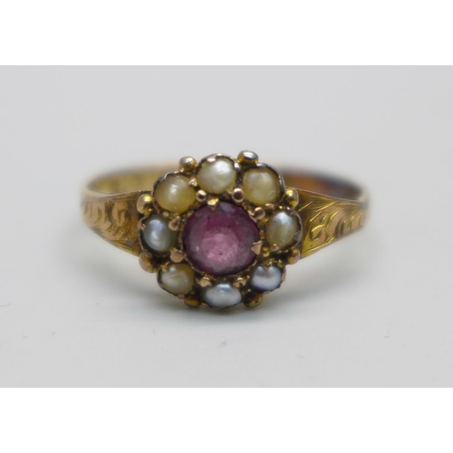 1055 - A Victorian 12ct gold ring set with garnet and seed pearl, Birmingham 1866, marked 12 and .5, 1.6g, ... 