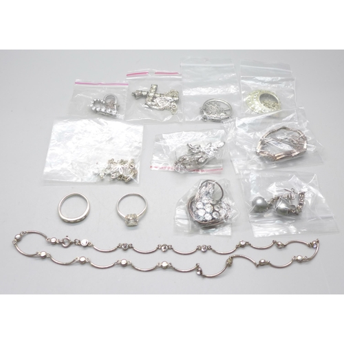 1079 - Silver jewellery including pendants and chains, earrings, etc.