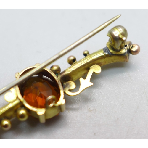 1084 - Two 9ct gold brooches; one set with a citrine and dated Birmingham 1901 and one set with an opal, to... 