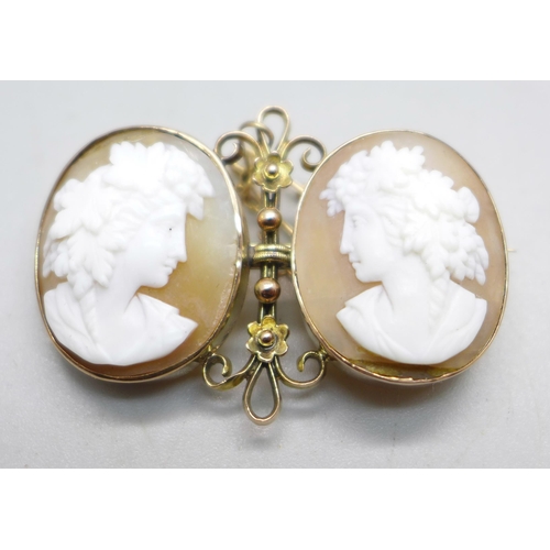 1085 - A 9ct gold double cameo brooch, 7.6g